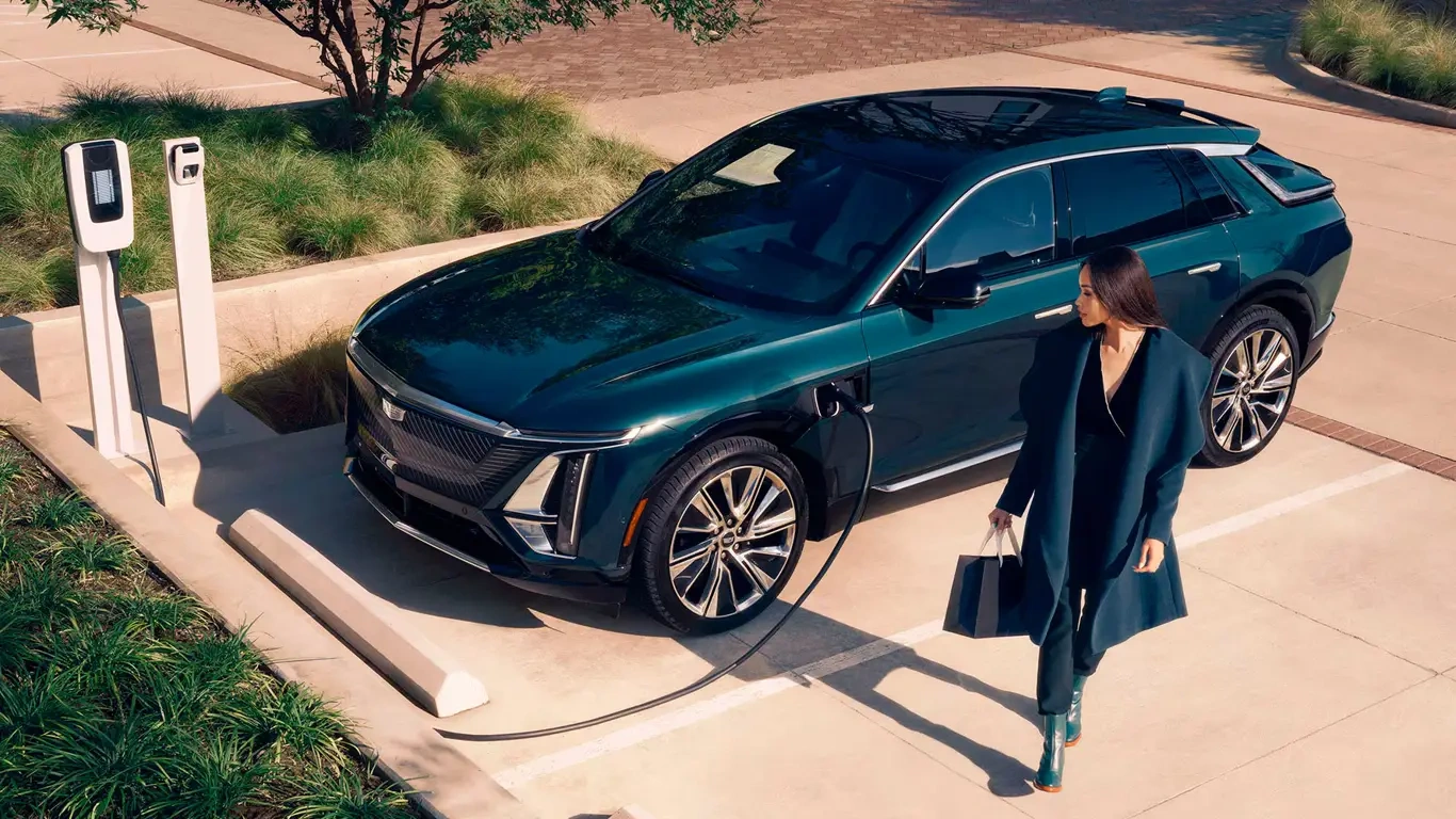 ,   : Cadillac    Tesla